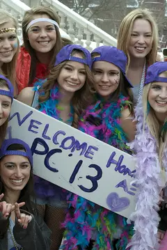 Alpha Xi Delta sisters prepare to meet their new pledge class members outside of the Schine Student Center Sunday. 