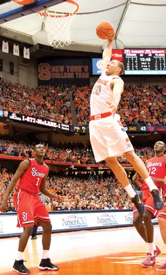 Syracuse shooting guard Brandon Triche skies for a dunk in the second half of the Orange's 77-58 win over St. John's.