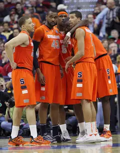 Brandon Triche #20, James Southerland #43, C.J. Fair #5, Baye Moussa-Keita #12 and Michael Carter-Williams #1 of the Syracuse Orange look on in a huddle on the court during the game against the Indiana Hoosiers.
