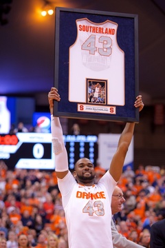 James Southerland hoists his framed jersey into the air during his Senior Night ceremony before the Orange's 78-57 win against DePaul Wednesday night.