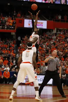 Rakeem Christmas leaps for the opening tip Saturday afternoon against No. 12 Louisville.