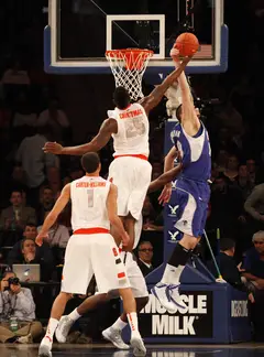 Rakeem Christmas (middle) blocks Aaron Geramipoor's (right) attempt at an offensive rebound.