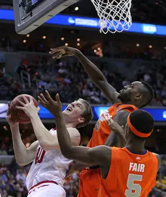 Cody Zeller #40 of the Indiana Hoosiers puts the ball up to the basket against Rakeem Christmas #25 and C.J. Fair #5.