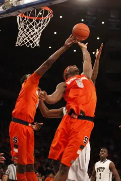 C.J. Fair misses the basket and tries to make a rebound.
