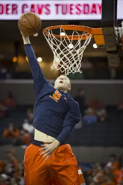Trevor Cooney throws down a dunk during warmups. 