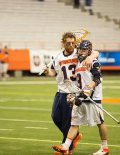 Reserve goalkeeper Evan Molloy consoles SU midfielder Billy Ward after the latter's collegiate career ended with the Orange's loss to Bryant Sunday night in the Carrier Dome.