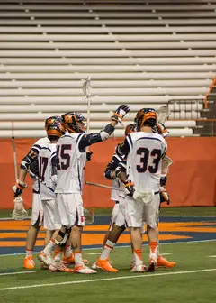 Syracuse players celebrate during the team's NCAA tournament first round game against Bryant Sunday night in the Carrier Dome.