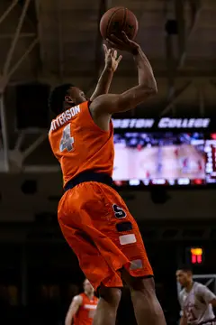 Syracuse reserve guard Ron Patterson releases a deep jump shot that rimmed out from the right corner.
