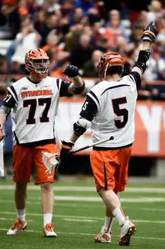 Henry Schoonmaker (77) and Nicky Galasso (5) celebrate one of Schoonmaker's three goals in the first quarter.