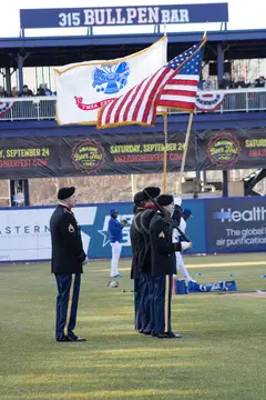 Members of the armed forces present the colors on the field before the gamel 