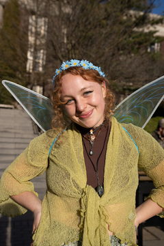 A portrait of Meg O'Brien, an ESF student donning fairy wings at Quadstock.