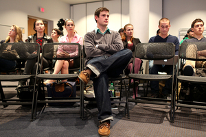 Dylan Lustig, SA president, looks on during the SA meeting Monday night in the Panasci Lounge in the Schine Student Center. Student safety continues to be a concern for campus police as rumors spread through the SU community that local gang initiations are the cause of increased crime in the East neighborhood. 