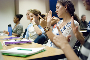 Students practice sign language during Teresa Gavagan's American Sign Language class. Members of the SU deaf community hope to show others that sign language is just one aspect of deaf culture. 