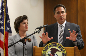 U.S. Attorney Richard Hartunian speaks Thursday as Syracuse Mayor Stephanie Miner looks on.