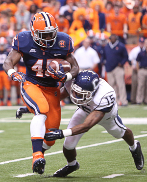 Jerome Smith moves the ball upfield in Syracuse's 40-10 win over UConn Friday night. Smith finished with a career-high 133 yards on 19 carries.