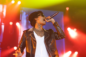 Wiz Khalifa rocks the microphone on Thursday night at the Oncenter War Memorial Arena. The Pittsburgh rapper performed hit single 