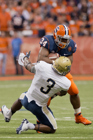 Syracuse running back Adonis Ameen-Moore barrels past Pittsburgh linebacker Nicholas Grigsby in the Orange's 14-13 win on Friday. Ameen-Moore gave Syracuse's goal-line package a much-needed boost. 
