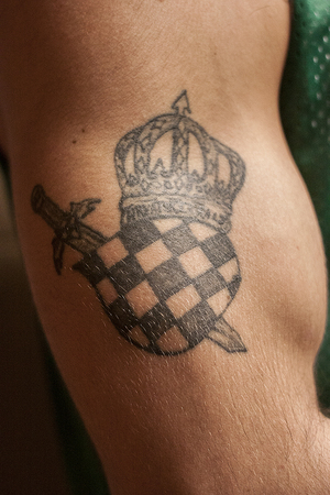 Max Zupanovic, a junior film major, displays the first tattoo he ever got done, which represents his Croatian heritage. 