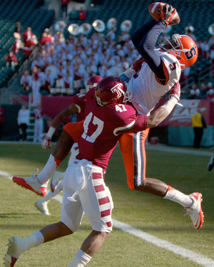 Marcus Sales catches a touchdown pass over Temple's Anthony Robey in the Orange's 38-20 win over the Owls on Friday.