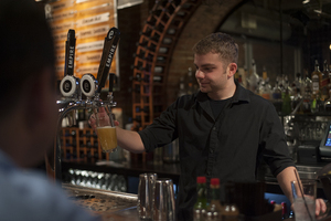 Kyle Schirtz, a bartender at Empire brewing Co., has been bartending for two years. In that time, he has learned to love the job while trying to improve and perfect the craft. 