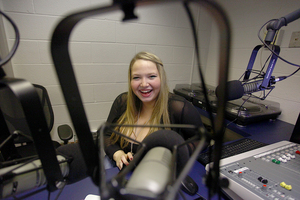 Chelsea Memet, a junior information management and technology major, sits in the studio at WERW, located in Schine Underground. Memet hosts her own show called 