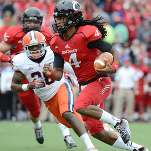 Cincinnati quarterback Munchie Legaux and the Bearcats rushed for 263 yards against Syracuse's struggling run defense. 