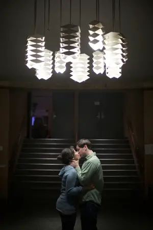 Kimberly Martinez and Matt Mouille share a kiss outside of Grant Auditorium. On December 5, 2012, Mouille proposed to Martinez in the same auditorium. 