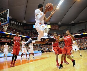 James Southerland keeps the ball from going out of bounds in Syracuse's 78-53 win over Rutgers on Wednesday in the Carrier Dome. The Orange took control of the game with a 21-0 run in the first half to pull away from the Scarlet Knights.