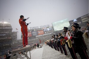 The SU Marching Band practices in the snow before the Pinstripe Bowl at a snowy Yankee Stadium on Saturday, Dec. 29, in New York City. The band is trying to raise $150,000 to replace its uniforms with a kickstart campaign called “A New Look for a New Era.”