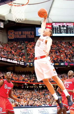 Syracuse shooting guard Brandon Triche skies for a dunk in the second half of the Orange's win over St. John's.