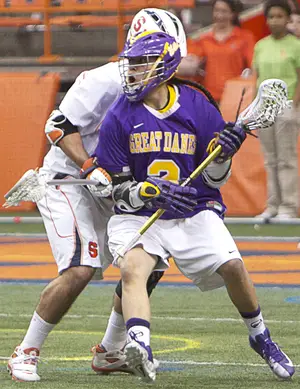 Miles Thompson looks to pass during Albany's 16-15 double-overtime win over Syracuse on Sunday. Thompson finished with three goals and two assists.