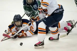 Margot Scharfe battles for possession against Mercyhurst. The Orange lost to the Lakers twice last weekend, clinching the conference title for Mercyhurst and locking SU into the No. 2 seed for the CHA tournament.