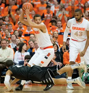 Syracuse point guard Michael Carter-Williams holds the ball away from the Providence defense. The sophomore finished with 15 points and 12 assists in the victory.