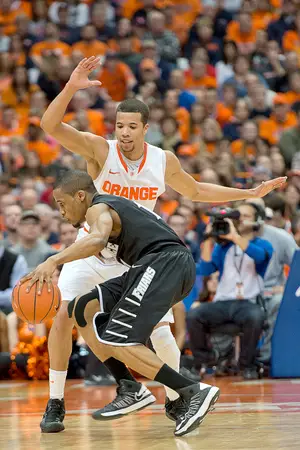 Bryce Cotton struggles to get past Michael Carter-Williams. The PC star was limited to 10 points in the loss to the Orange.