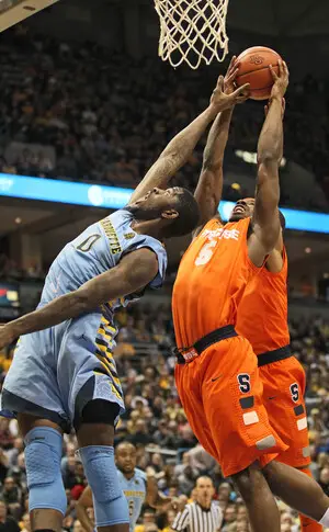 C.J. Fair fights for a rebound with Marquette forward Jamil Wilson. Fair scored 20 points in Syracuse's 74-71 loss to the Golden Eagles, but Fair wasn't the star as Marquette's Devante Gardner scored 26 points, 18 in the second half. 