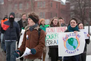 Students who are a part of the Fossil Fuel Divestment Campaign chant as they march from the steps of Hendricks Chapel to Crouse Hinds Hall. The group was advocating for the university to stop investing in fossil fuels. Students also discussed the issue with administrators. 
