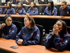(From left) Syracuse forward Pachis Roberts and guards Brianna Butler and Cornelia Fondren watch the selection show on ESPN, awaiting the Orange's placement in the NCAA tournament.