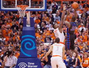Syracuse forward Rakeem Christmas blocks a shot in the second half of the Orange's win over DePaul. Christmas struggled for much of the game, but excelled defensively late in the first half when SU ran away from the Blue Demons.