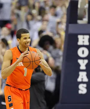 Michael Carter-Williams clutches the ball in Syracuse's 61-39 loss to Georgetown Saturday at the Verizon Center. The sophomore guard scored 17 points and shot 8-for-13 from the field.