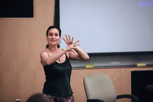 Suzie Cagnon, a Cirque du Soleil musician, talks to students about her time traveling with the performance troupe after screening the new film “Alegría.”