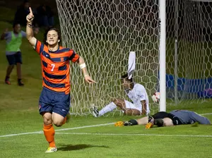 Freshman Alex Halis celebrates after scoring a goal against Manhattan. Halis logged two goals and an assist as the Orange cruised to a 4-1 win.