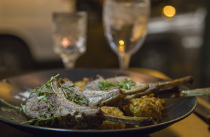 The 317 serves American-fusion food, including this roasted lamb rack served over sautéed squash with a side of tater tots in a roasted garlic cream. The diverse menu also features crème brûlée, a curried chicken salad wrap and a marinated salmon salad.
