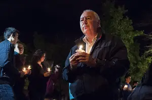 Graham Herbert, the principal of Lockerbie Academy in Scotland, pays respect to the 35 SU students who died in the Pan Am Flight 103 bombing at the candlelight vigil. This year is the 25th anniversary of the tragedy, which will be honored during Remembrance Week 2013.