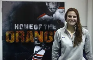 Sadie St. Germain designed a large sticker for the door outside the Syracuse locker room. 