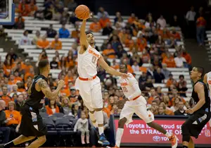 Forward Michael Gbinije, who is doubling as Syracuse's backup point guard, turned the ball over five times against Division II Holy Family (Pa.) University.