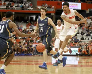 Michael Gbinije committed three more turnovers in Syracuse's preseason finale against Ryerson University. The forward is the Orange's backup point guard behind freshman Tyler Ennis.