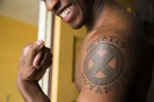 Malcolm Whitfield, a junior art photography major, shares this X-Men logo tattoo with his twin. The tattoo is a daily reminder of his brother, who serves in the Air Force.