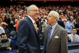 Syracuse head coach Jim Boeheim laughs with North Carolina head coach Roy Williams before SU's 57-45 win on Saturday.
