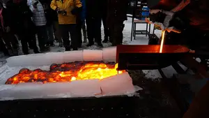 The SU Lava project team pours molten lava onto ice.  The lava is more than 2000 degrees Fahrenheit.