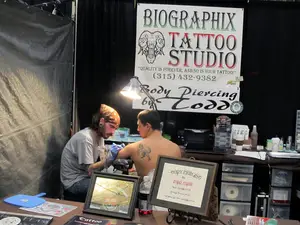 A participant at the Annual Am-Jam Tattoo Expo gets new ink. The event is back in Syracuse for its 28th year.
